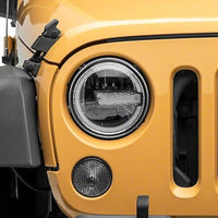 Raxiom 97-18 Jeep Wrangler TJ/JK 7-Inch LED Headlights w/ Halos- Black Housing (Clear Lens)