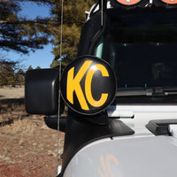 KC HiLiTES 6in. Round Soft Cover (Pair) - Black w/Yellow KC Logo